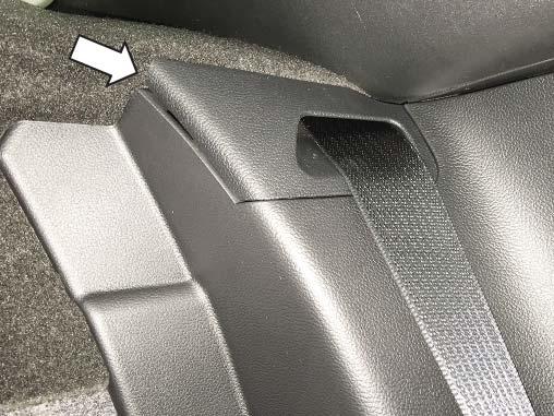 rear seat and fold it down to gain access to the seat belt guide