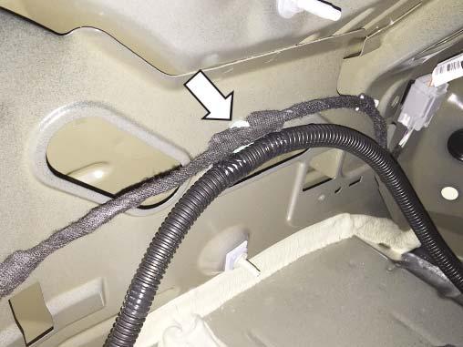 ring clip from the active exhaust wiring harness and then reinstall the