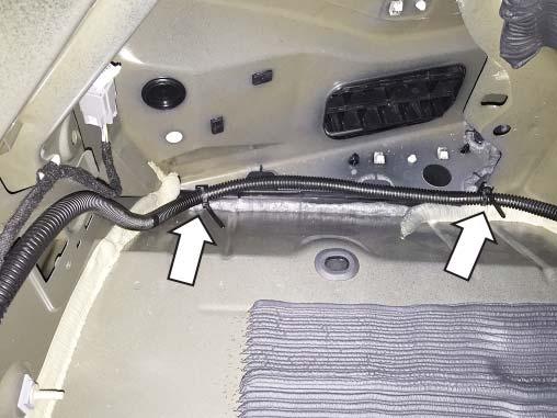 Route the wiring harness along the driver side of the trunk into the