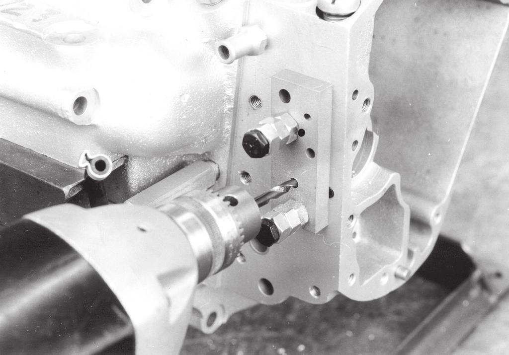 Install S&S Oil Pump Drill Jig part #53-0013 on gear cover gasket surface. See Picture 29. b. Using.