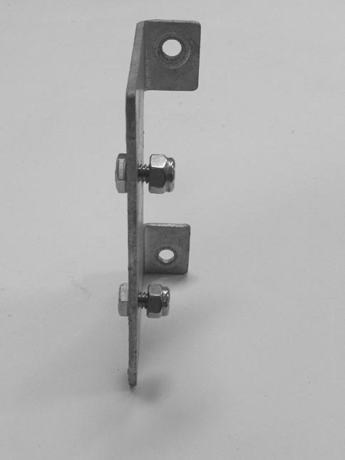 Position the bolts through the stud mount plate as shown, and install lock nuts