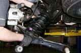 Remove the 10mm brake line support bracket bolt,