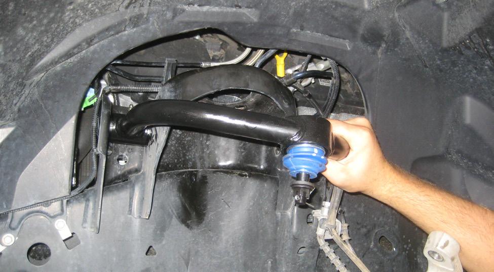 Locate the new driver side upper control arm part # 23000-01.