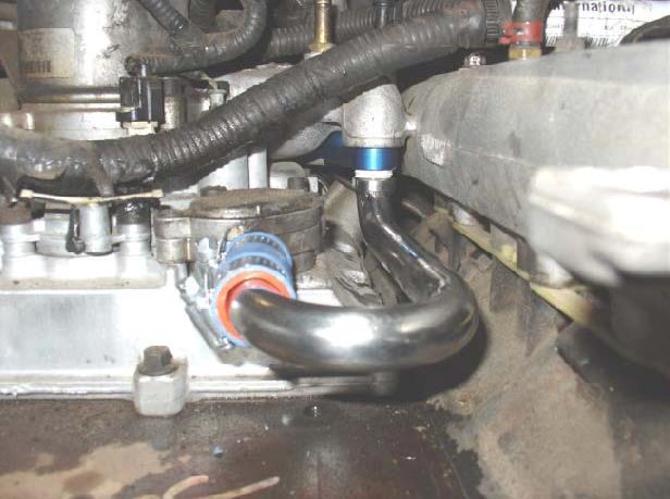 Step 20: Install the 3/4 silicone hose, 3/4 180 degree Stainless steel coolant tube provided, and the worm drive hose clamp