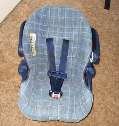 The rear right seat was occupied by an 11-month old male (66 cm/26 in, 11 kg/25 lbs) seated in a Graco Snugride (Model 8457 MV) ISS that was being used in a rear facing fashion.