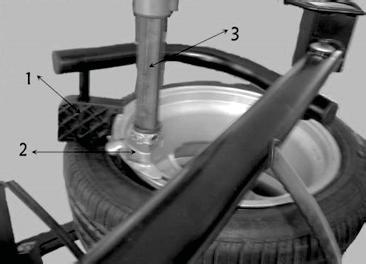 of the rim (Fig. 37). Push down on the manual valve to press the rim down until the rim is lower than the surface of the claws.