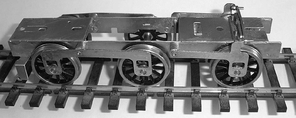 Because the coefficient of friction for steel wheels on nickel silver track is about 5, we need 5 times this weight on the driving wheel, which is 550g.
