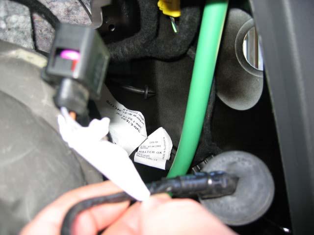 18. Push the passenger side taillight wiring harness through the body and into the cubby hole in the cargo