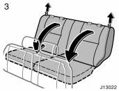 CAUTION Flattening seatbacks (manual seat) 3. Unlock the seatback and fold it down. This will enlarge the luggage compartment as far as the raised seat cushion.