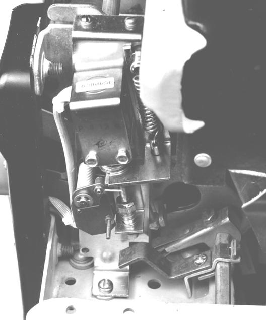 5. When the flux shifter and its trip paddle are installed and the front and back frames are reassembled, the flux shifter must be adjusted as follows: a.
