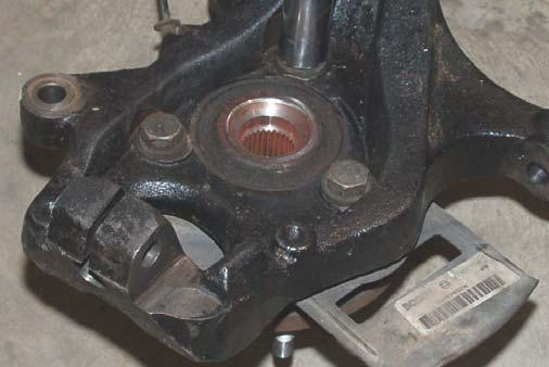 It may be necessary to use jack stand to install the lower bolt. Tighten using a 14mm wrench and 19mm wrench 41.