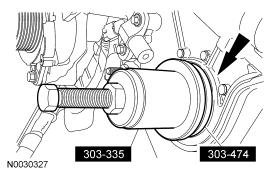 2. NOTE: Lubricate the crankshaft front seal lips with clean engine oil prior to installation. Assemble the special tools, then place the crankshaft front seal onto the special tools. 3.