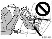 LS13016 CAUTION Do not install a child restraint system on the rear seat if it interferes with the lock mechanism of the front seats.