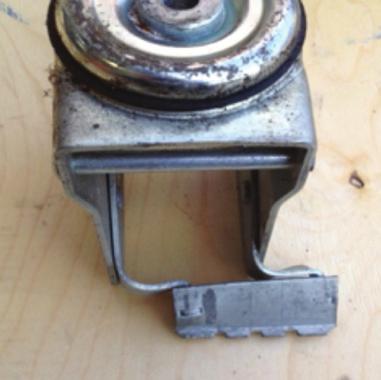 Foot pedal distortion as a result of a significant frontal impact; it is likely the top plate and bearing will be distorted as well.