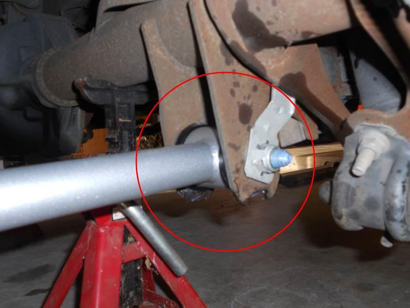 13. Slide rear arm bushing into axle bracket. This was a tight fit for my installation. Use the dead blow hammer to persuade it into place. Be careful not to tap arm above the bolt hole.