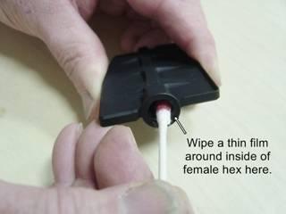 #32 Now wipe a thin film inside the female hex pocket of the new flapper valve. Don't over do it, it should just be wet on the sides.