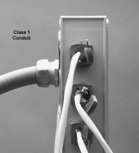 Be sure to install an EMI sealing gasket, supplied with the filter, between the access panel and fuse box as shown. For non-mri installations, the filter box is not required.