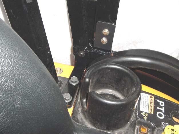 1 For ease of handling, remove the door from the side frame by lifting up and off the pin hinges that are bolted to the side frame. 3.2 See fig. 3.2. With assistance, install the right side frame to the tractor.