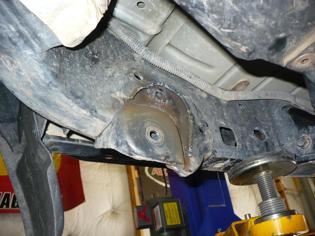 cutting the passenger side front lower control arm mount