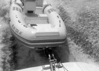 Then hook the winch strap to the bow eye, winch the dinghy tight against the bow roller stops, and you re ready to go.