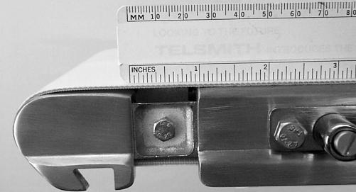 For a new belt: With V-guide seated in pulley, rotate tension handle (X of Figure 27) counter-clockwise to a distance of 1 (25 mm) (AF of Figure 28).