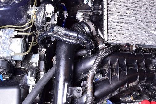 Install the engine cover bracket on the front of the engine. 37 38 1" wrench Find the 60" long piece of 5/8" PCV hose.