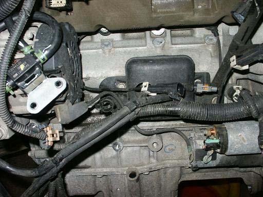 21. If installing our lower charge tube, remove the lower tube at this time. Remove the plastic vacuum tank shown here.
