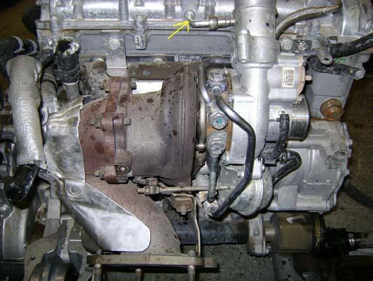 7. Here is a view of the stock turbo for reference. Remove the heat shield from the top of the turbo. CAUTION!