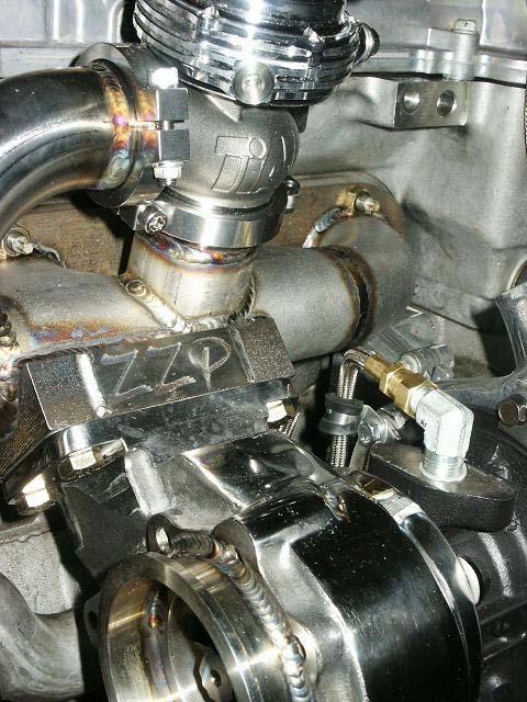 Use the supplied clamp to keep the oil line away from the turbo exhaust housing.