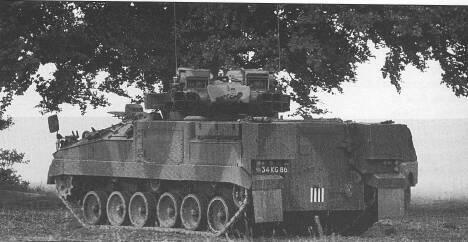 ) Right: Rear view of Warrior with turret slewed rearwards, revealing infantry access