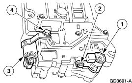 4. Install the 3-4 shift solenoid bolt. 5. Install the solenoid wiring harness and bolt. 20. Install the torque converter clutch (TCC) solenoid and the 1-2 shift solenoid. 1. Install the TCC solenoid.