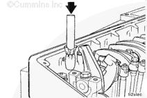 Install ISM Engines CAUTION To reduce the possibility of injector sleeve damage, do not use anything metal to scrape the copper injector sleeves.