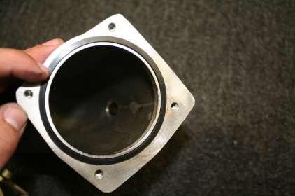 g. For 82mm Throttle Body: Applying Black RTV Silicone to the Inlet Elbow and bolting on the
