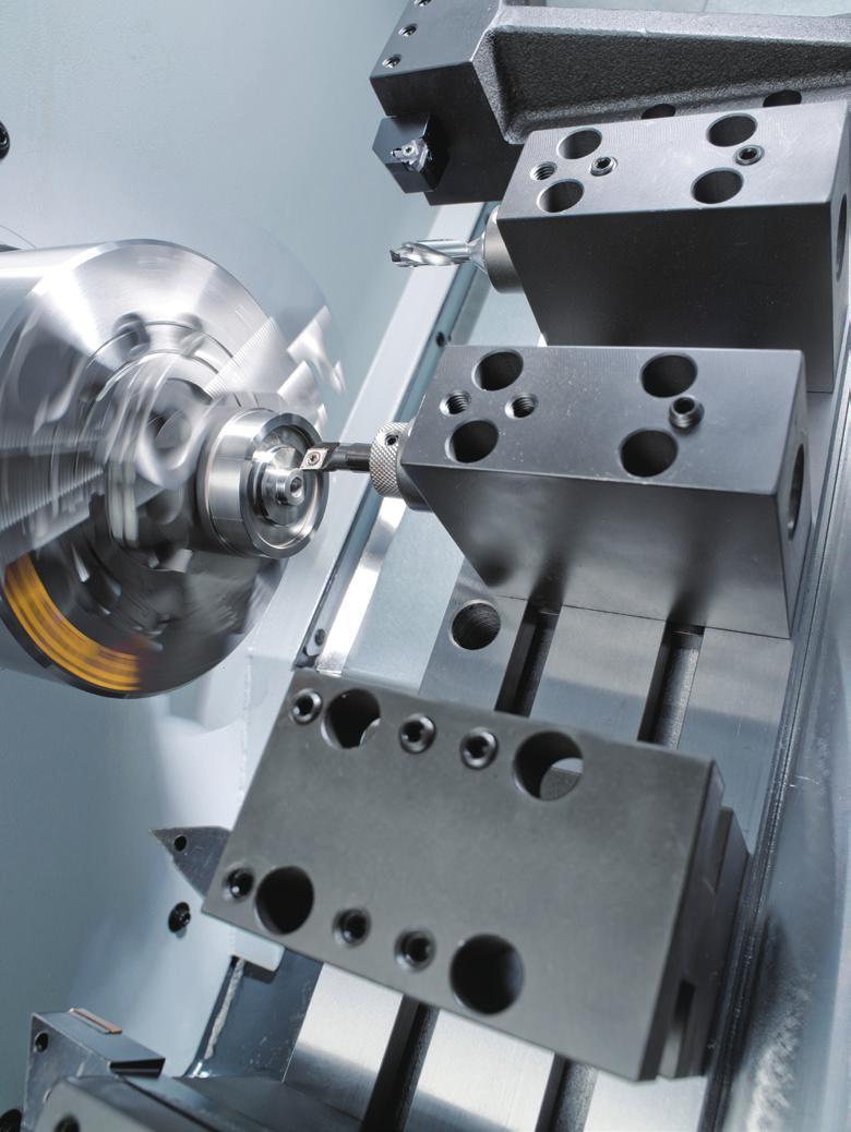) Living tooling capabilities on the T-100 series allows a work-piece to be turned, milled, drilled and tapped without moving it to another machine.