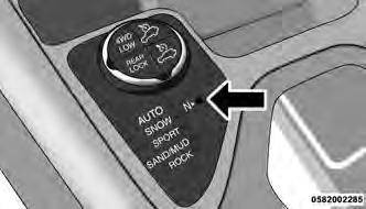 6. Using a ballpoint pen or similar object, press and hold the recessed power transfer unit NEU- TRAL (N) button (located by the selector switch) for one second. Neutral Switch 7.