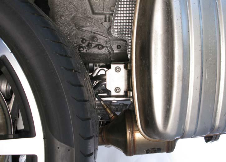 8. Unscrew the marked nuts on both sides of the vehicle and carefully remove the side mufflers off the vehicle (Figure 12).