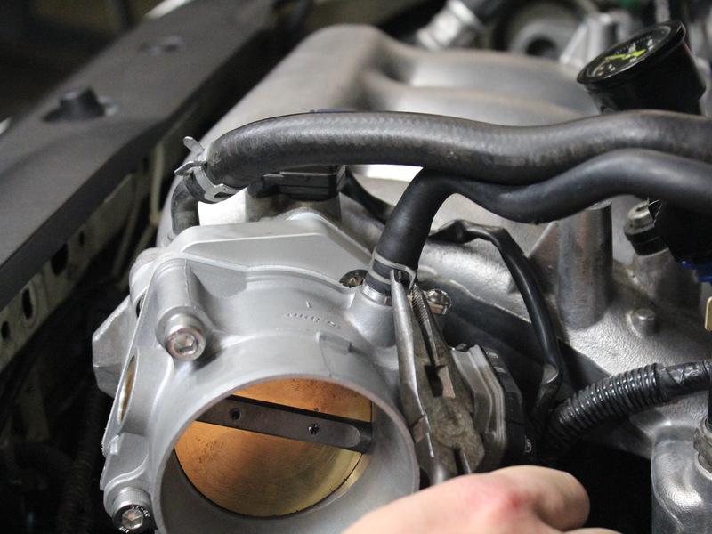 Optional: Connect the coolant lines for the throttle body back to the ports on the throttle in