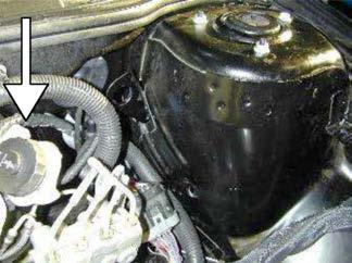 q. Remove the washer bottle/air box assembly from the vehicle.