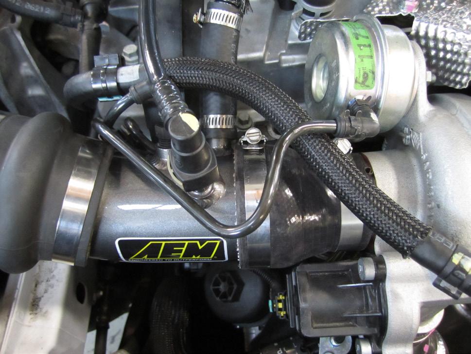 g. Re-connect the vacuum line elbow to the turbo wastegate