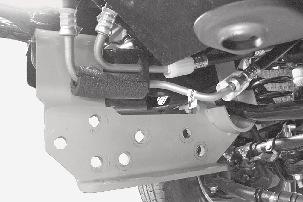 For trucks requiring the oil cooler to be reassembled to the frame rail, locate the three 8mm flange head hex bolts and standoff spacers in the bolt