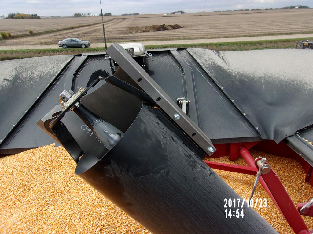 AUGER DELFECTOR INSTALLATION Step 1: Open the combine s power fold extension or cover and turn off the engine.