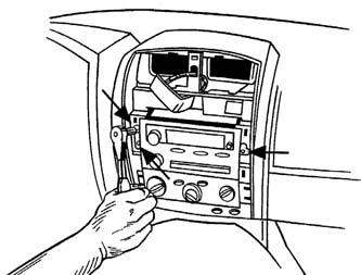 Unsnap and remove the entire panel surrounding the radio