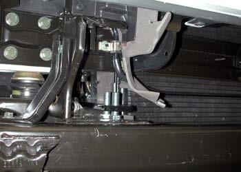 Remove the upper 17mm head bolts (one on each side) holding the bumper