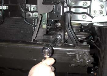 Fit two ½" x 1½" bolts into place at the front of each brace (Fig.