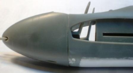 Since the gun nose section (part #61) comes as one piece and not two halves, the cockpit tub must be inserted and the fuselage glued together before the new nose section can be grafted on.