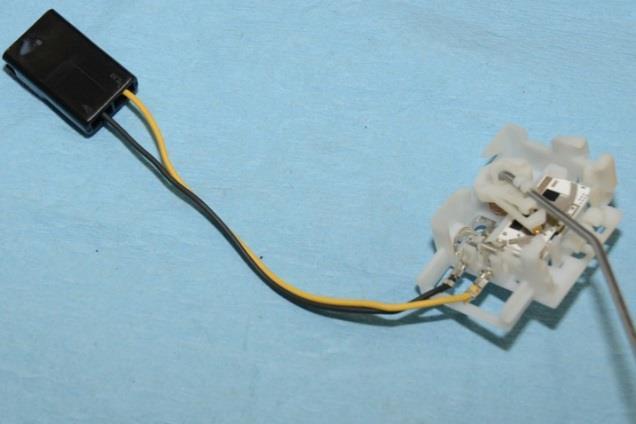To install the fuel temperature sensor (if equipped), cut the 2 black wires at the white OEM connector allowing as much slack as possible.