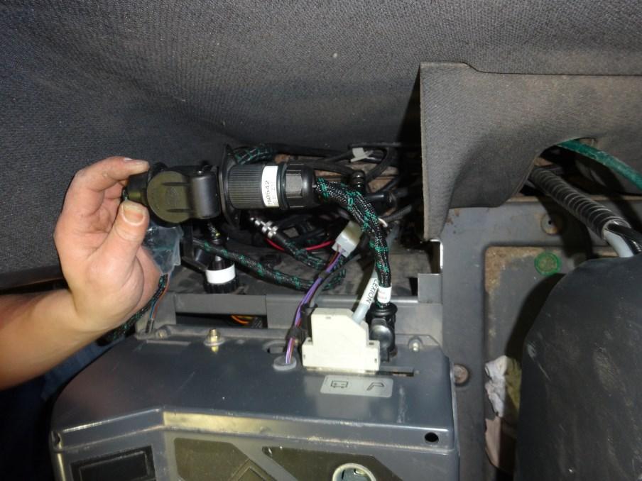 connector on the cab harness and the 12 volt power supply on the rear of the operators panel.