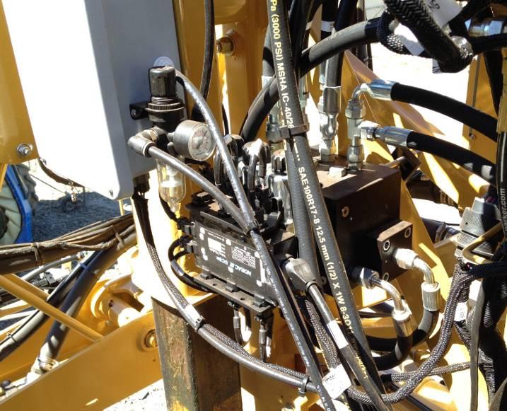 10.2 Valve Block Mounting 1. A suitable mounting location for the valve block on the Rogator is illustrated in Figure 22. 2. Insert the threaded rod into the block and use a hex nut to hold the rod.
