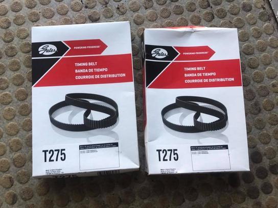 2 brand new Gates T275 belts Place the new belt on the back crankshaft pulley and keep the
