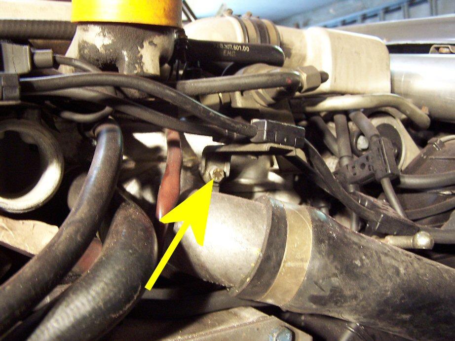 Making clearance for the Supercharger Intake: Remove the bolt that holds this spark plug wiring harness holder to the engine,
